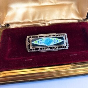 Antique silver tone enamel victorian brooch. Floral elements.